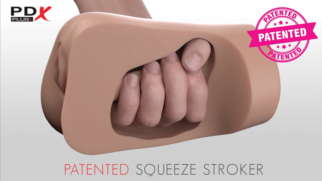 Patented squeeze stroker with a hand gripping it on a light gray background